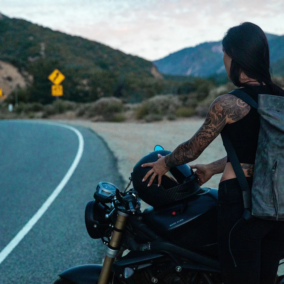 Motorcyclist riding through mountain roads