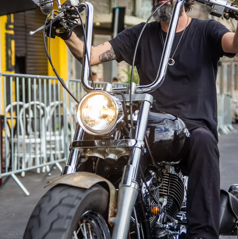 Motorcycles parked at a community gathering